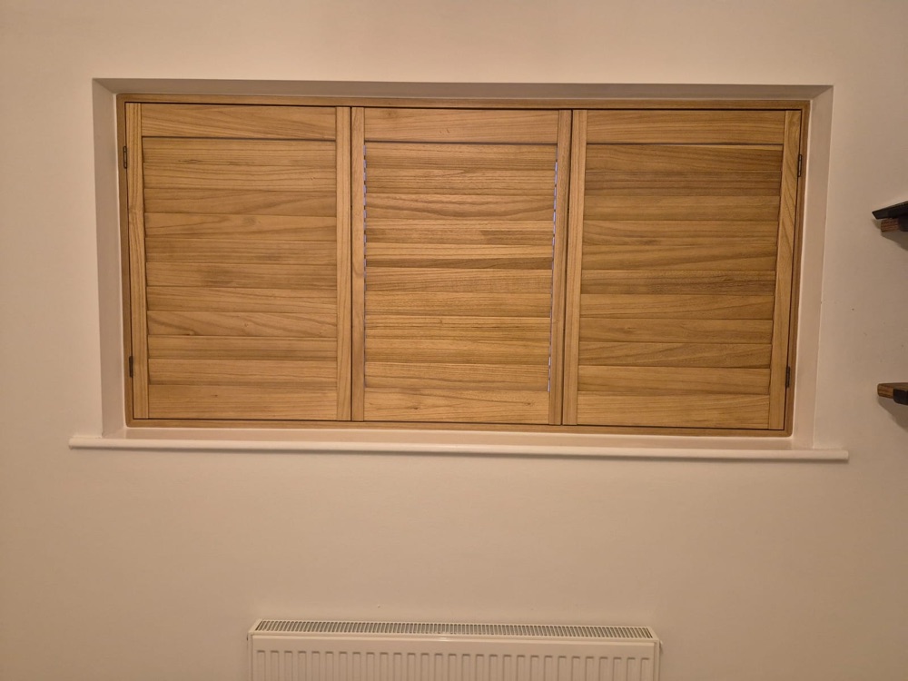 Warm wood-finish plantation shutters in a home